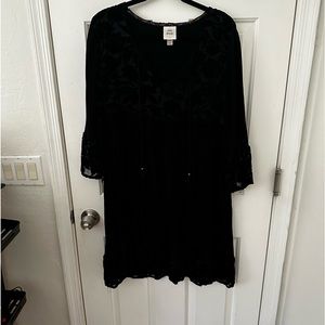 Black dress with flower and ruffle detail